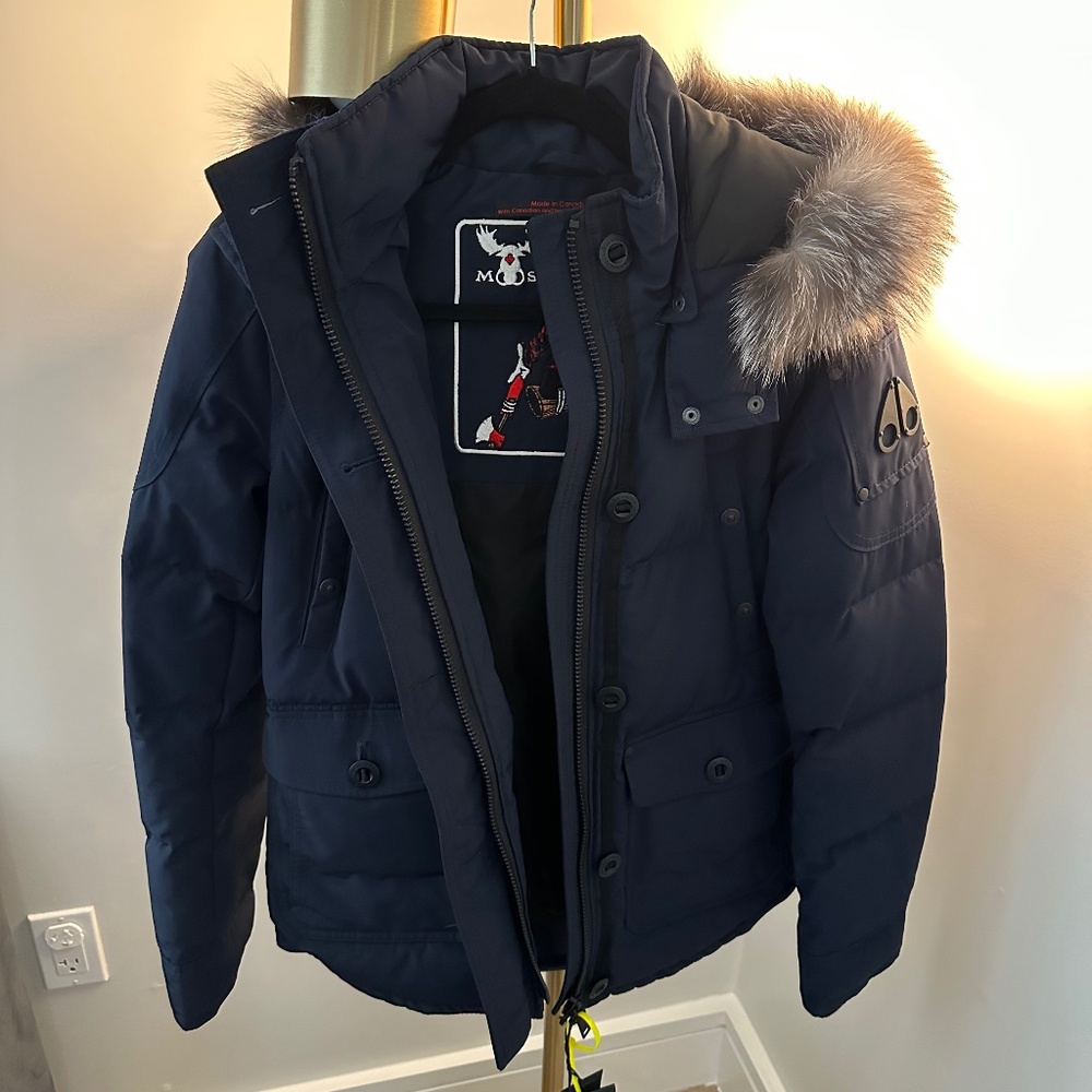 Women’s never worn navy Moose Knuckles coat (with tags)
